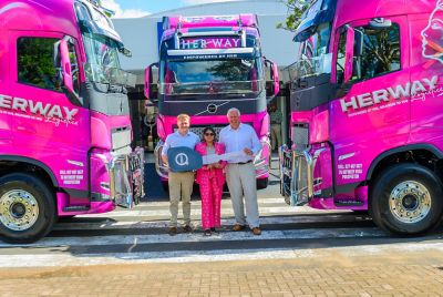 Kiara Baijnath (center) takes ownership of five brand-new FH extra heavy trucks, presented by Herman Steyn, Volvo Trucks Sales Executive (left) and Anders Friberg, Director of New Truck Sales at Volvo Trucks South Africa (right). 