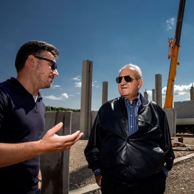 Father Giorgio at the building site of the new Sartori headquarters.