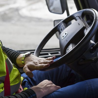 Driver steering a Volvo FH