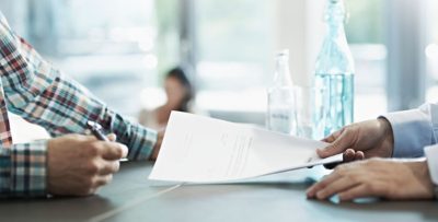 Volvo Group employee holding a document