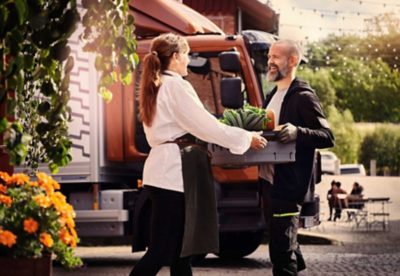 Volvo FL truck driver delivers vegetables