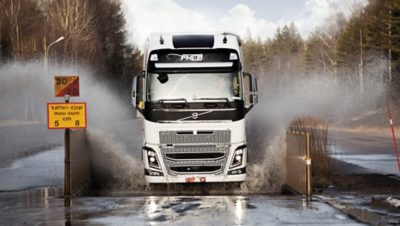 Volvo FH driving through water
