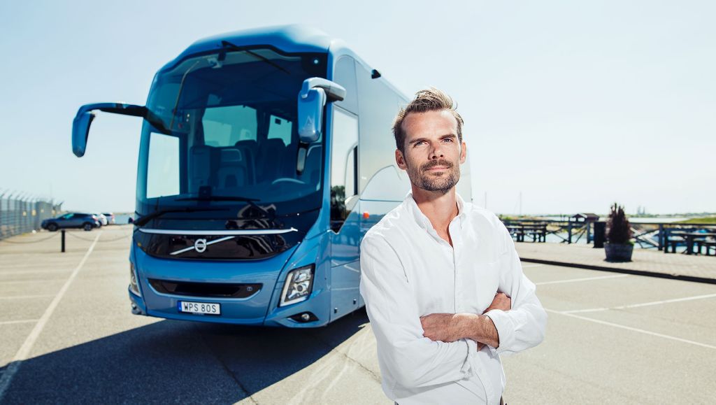 Karl Johansson, Business Development Director, Coach Europe at Volvo Buses, outside a coach.