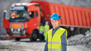 Sasko Cuklev head of On-Road Solutions at V.A.S. standing in front of Volvo FH truck in Brönnöy