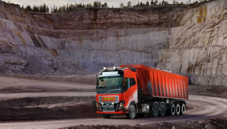 Red Volvo autonomous truck in a quarry in Brönnöy