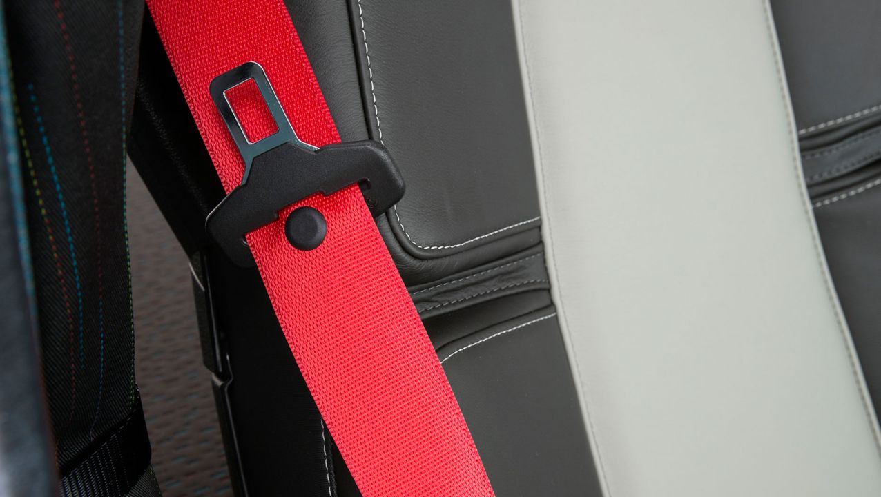Red seatbelt inside a Volvo Group vehicle