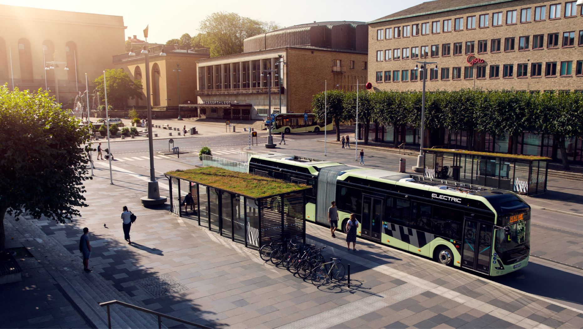 An electric bus stops at a bus stop