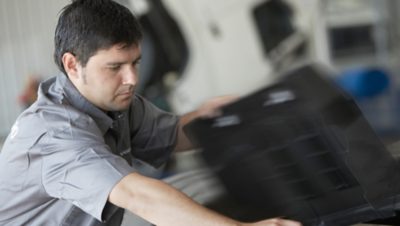 Volvo Group worker in a grey Volvo shirt