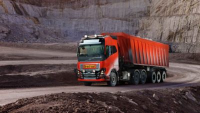 A red automated Volvo truck part of Volvo Group's first autonomous commercial solution in a lime stone pit mine in Norway,