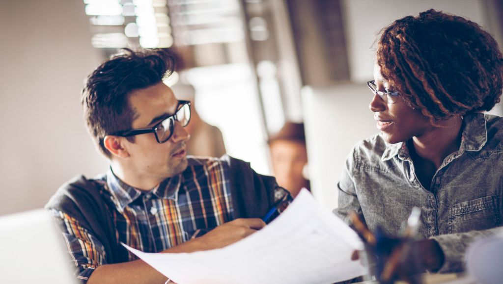 Man and woman discussing in an office