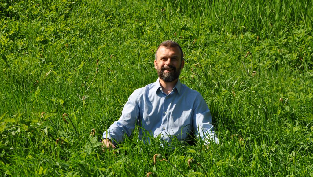 Eric Way sitting in the grass