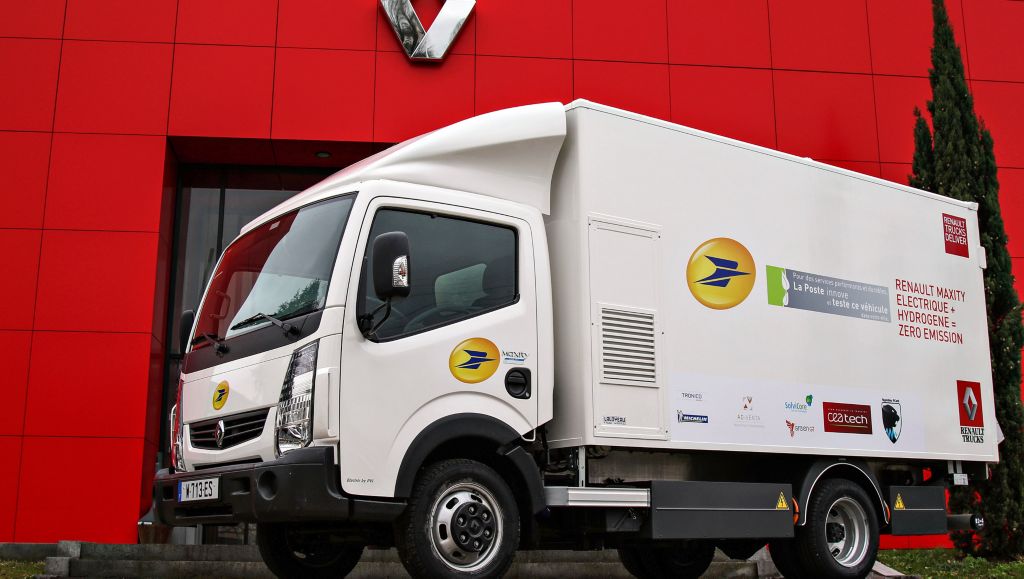 A Renault truck with the La Poste logo outside a Renault Trucks office