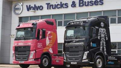 The two eye-catching Volvo FH with I-Save demonstrator trucks will help raise money for Breast Cancer Now and Prostate Cancer UK