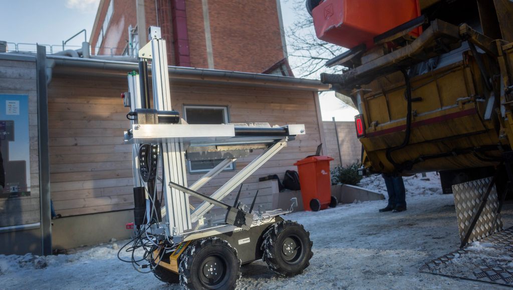 Refuse truck driver is supported by robot