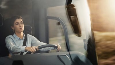  Female bus driver behind the steering wheel