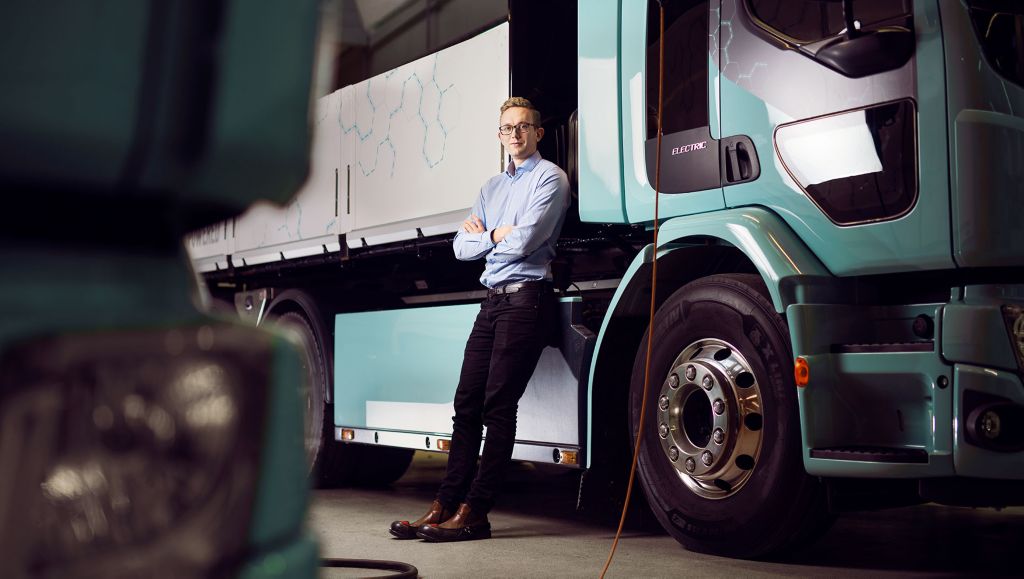 Rikard Vinge, Data Scientist at the Volvo Group, alongside one of Volvo’s electric trucks