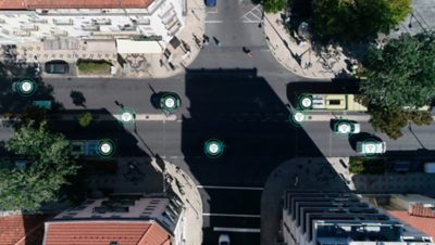 Intersection where graphics show the communication between vehicles and traffic lights