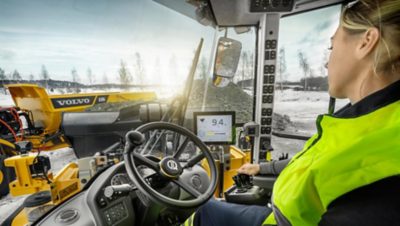 A woman operating Volvo construction equipment I Volvo Group