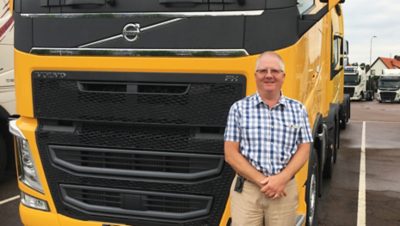 Man standing in front of Volvo FH