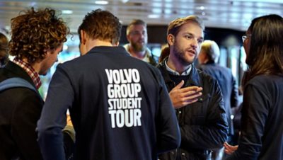 Volvo Group employees, representing the Volvo Group Academic Partner Porgram, speaking with students