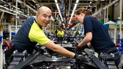 Two Volvo Group production workers in the Hagerstown factory