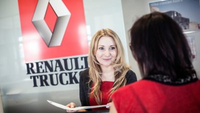 A Renault Trucks employee speaking with a customer