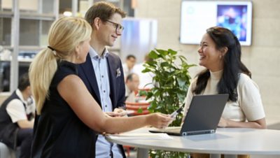 Volvo Group saleswoman in a meeting with her clients