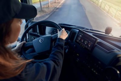 A Volvo truck driven by a woman