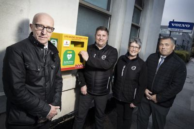 Ian Middleton of Hartshorne with staff and the defibrillator at the company's Burton depot.