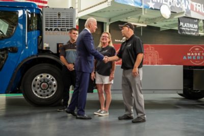 President Joe Biden by the Mack LR Electric refuse vehicle | Volvo Group