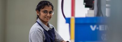 Girl who is working with machines