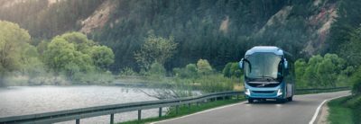  Bus on a mountain road by a lake