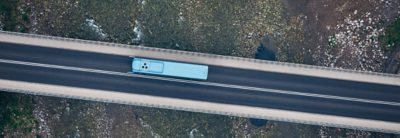 Bus on a bridge over a dried out riverbed