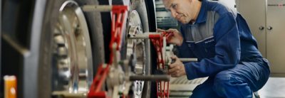 Technician checking wheel