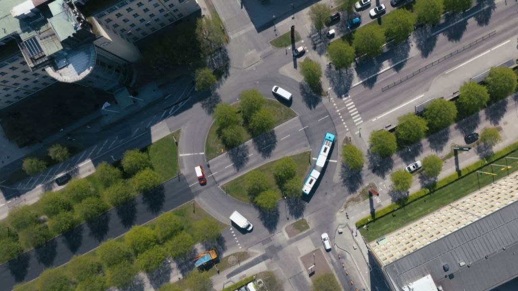 A Volvo bus in a roundabout seen from above