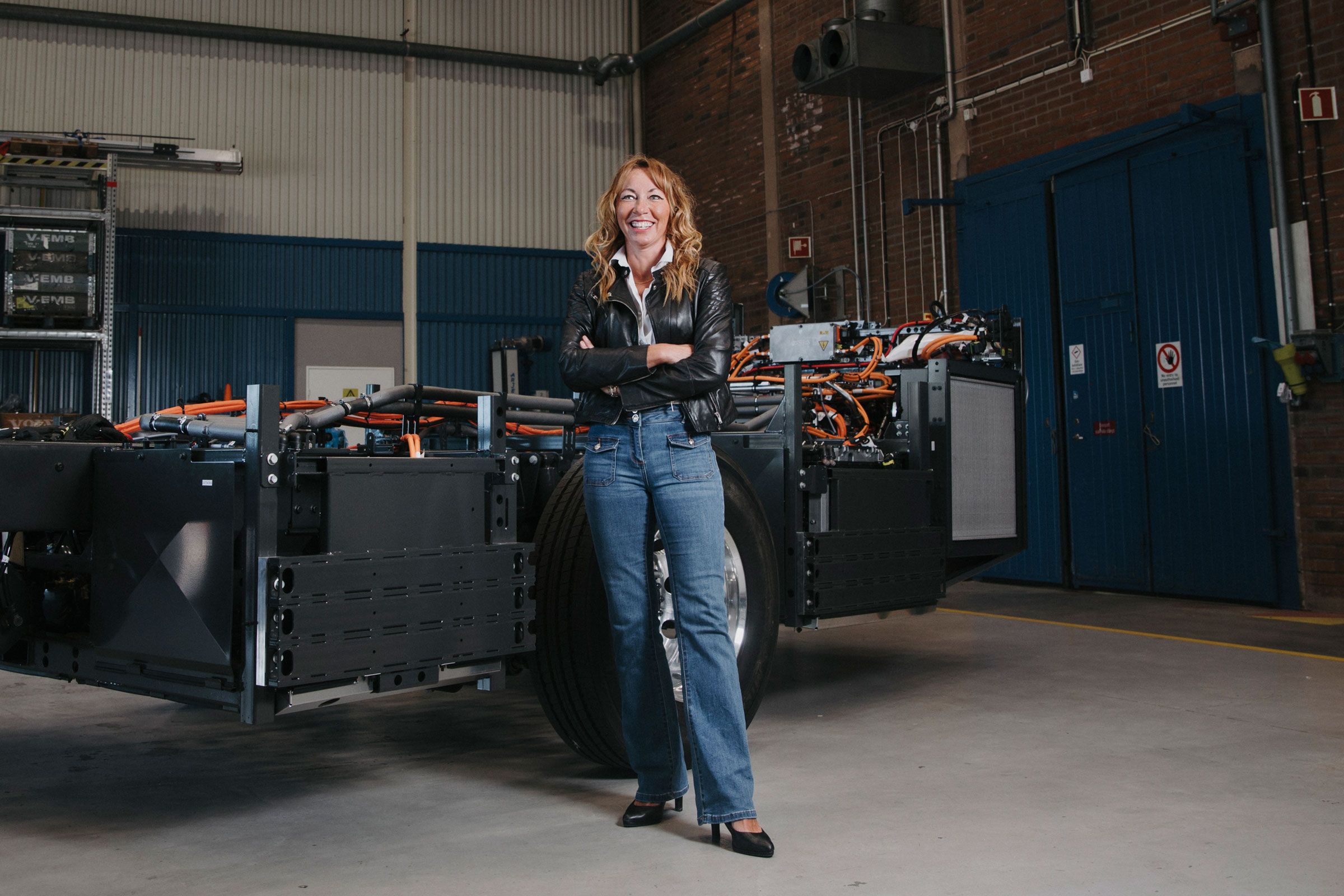 Carina Borelius, Vice President Services, Solutions & Electromobility, Business Unit Chassis at Volvo Buses in front of a BZR chassis.