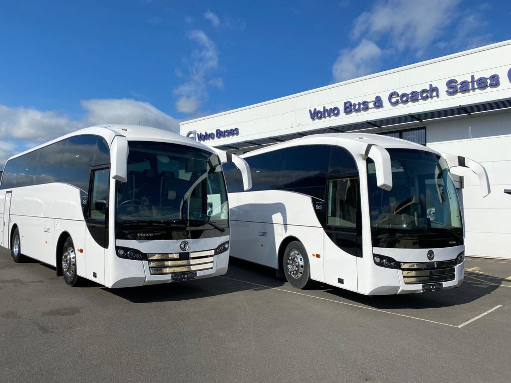 two white buses at volvo buses and sales centre