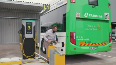 Kris Kokot charging an electric Volvo BZL