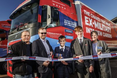 from left to right) Darren Wright, Founder of Veterans into Logistics; Carl White, Used Truck Director for Volvo Trucks UK & Ireland; with Stuart Bird’s two sons and widow, Noah Bird, Alfie Bird and Tracie Bird.