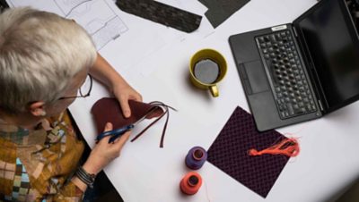 Aerial view of Carina Byström cutting a leather sample