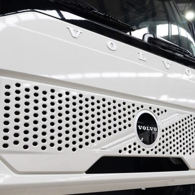 Volvo FM Electric cab next to a garage door