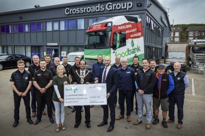 The Mayor and Sandy Bennie (centre) with staff at the Crossroads Truck & Bus depot in Canklow Meadows, Rotherham. 