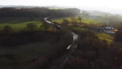 An aerial view of a road cutting through the countryside in northern England 