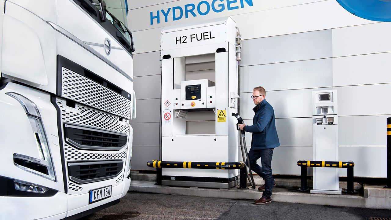 Person filling a Volvo Truck with hydrogen fuel