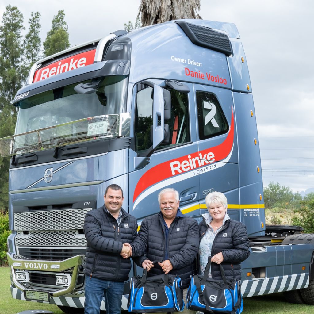 Oom Danie Vosloo receiving some Volvo branded merchandise at the handover of his new Volvo truck.