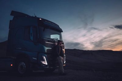 A shot of a truck against the sky and a landscape