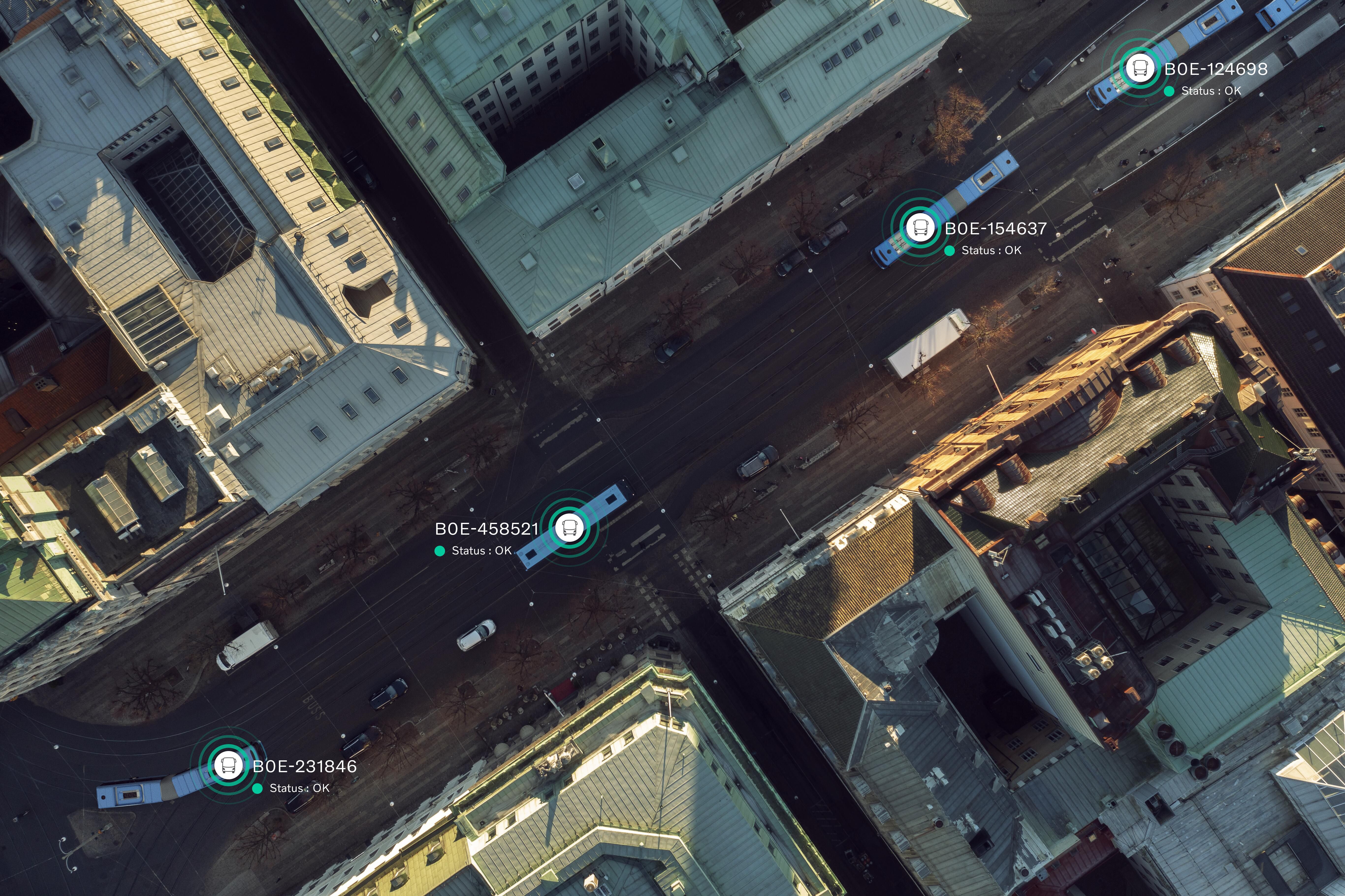 Aerial view of street with connected buses