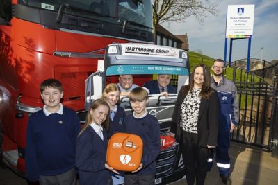 Primary school receives heart defibrillator donated by staff at vehicle distributor
