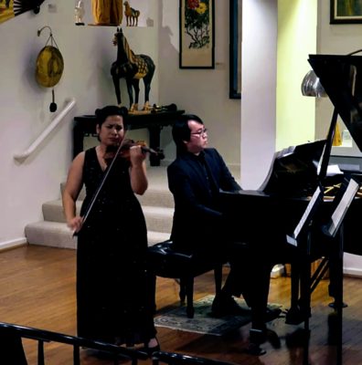 Alice Silva playing at a recital