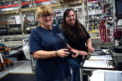 Two man analyzing the graph on production floor | Volvo Group